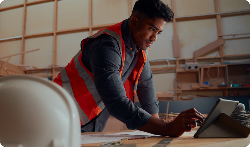Construction worker using a tablet