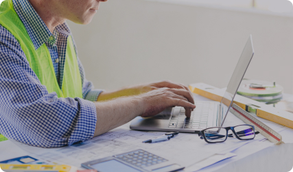 Construction worker using laptop