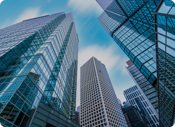 Picture looking up at skyscrapers from ground level
