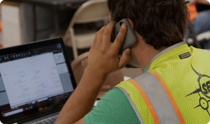 Construction worker on the phone while working in Revu