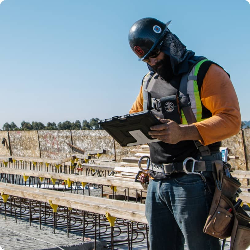 Construction worker looking at tablet