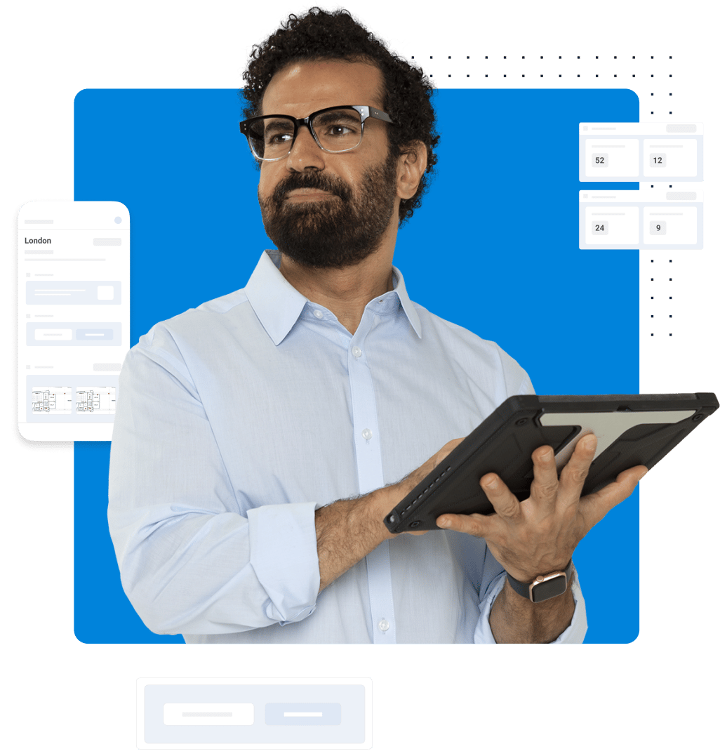 man working on tablet device with Bluebeam construction software UI in the background