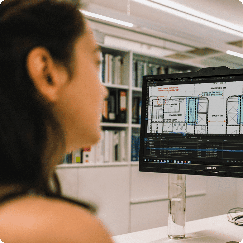 Side Profile of woman looking at computer monitor