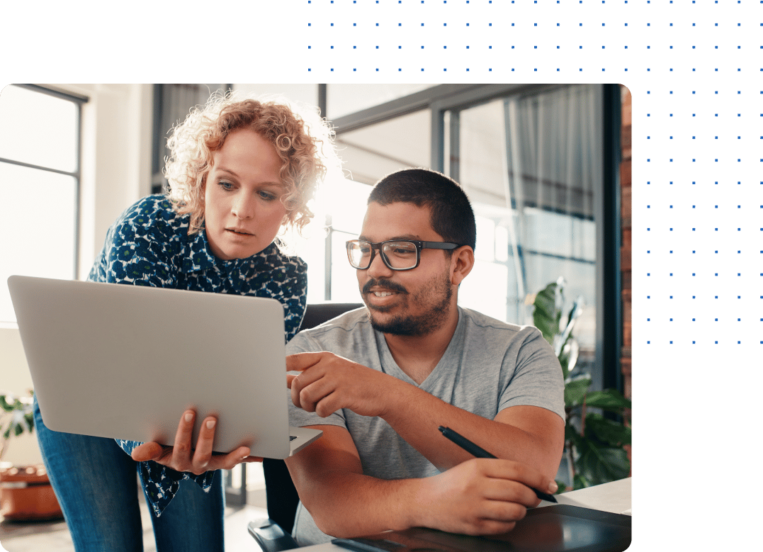 Two People looking at a laptop