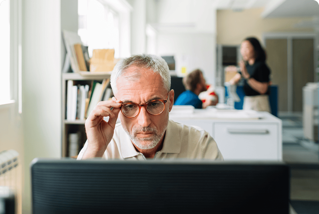 Man looking at computer monitor