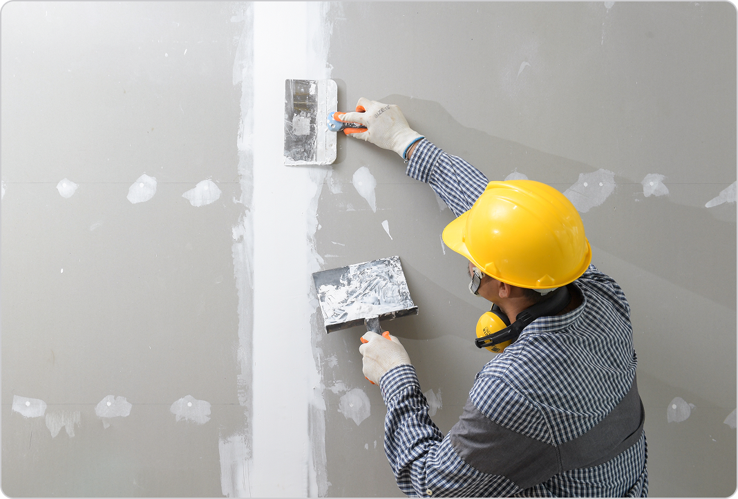 Professional working on drywall