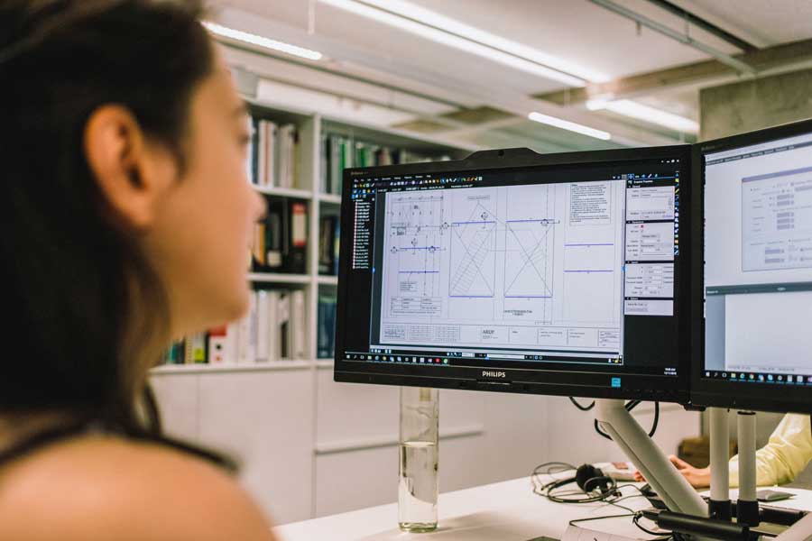 woman comparing drawings in construction software