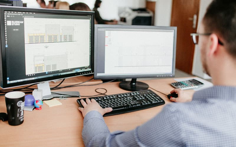 man working on digital construction software