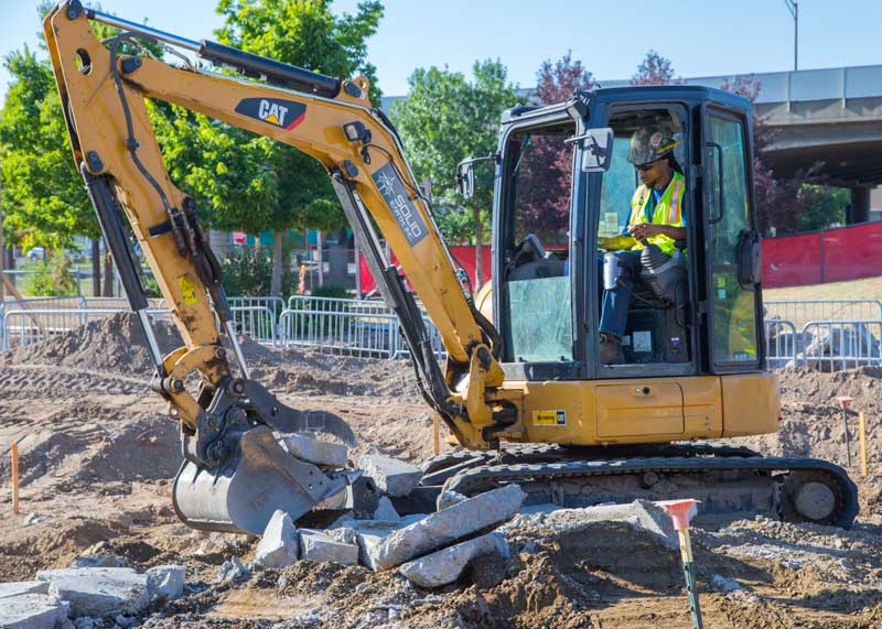 Excavator on Solid Earth job site