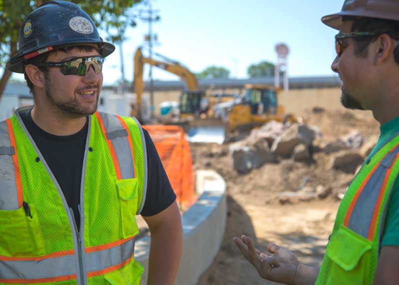 two men on construction job site