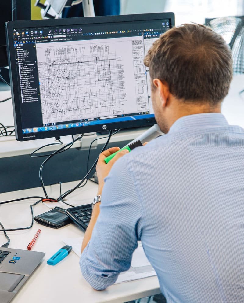 man working on construction software in office