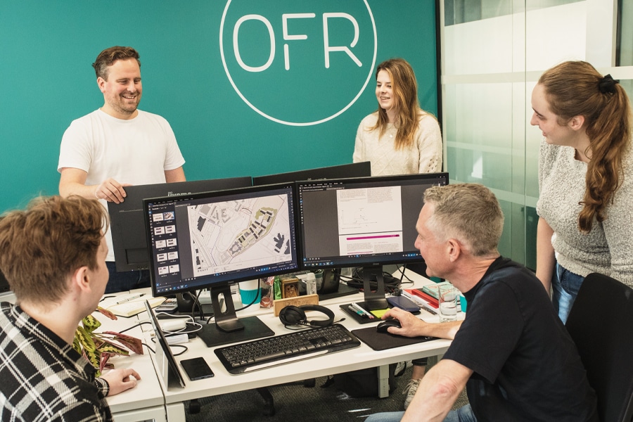 people in OFR office viewing construction drawings