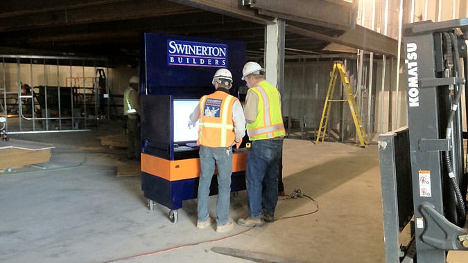 two men in PPE on Swinerton jobsite