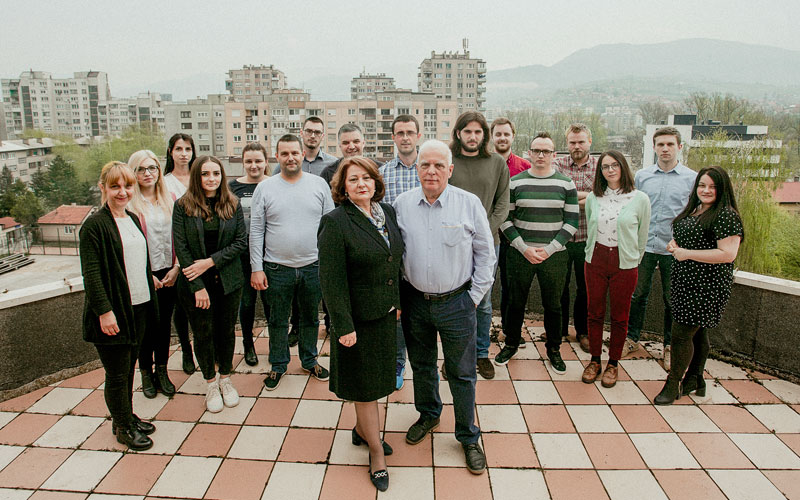 group of people on a balcony