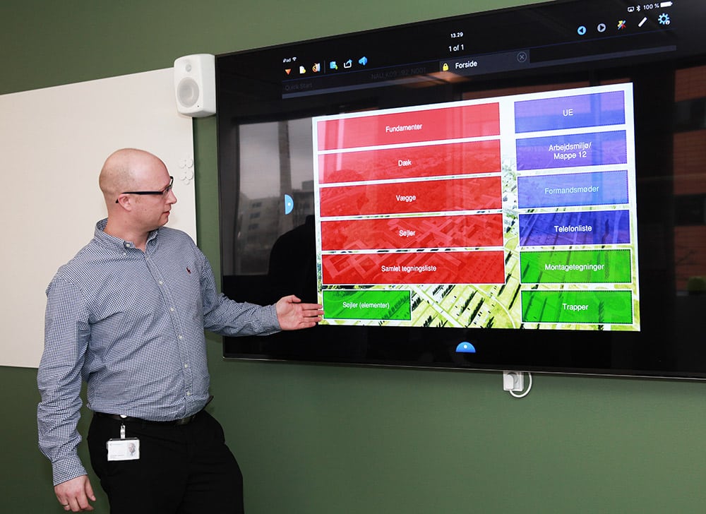 man showing construction dashboard on screen