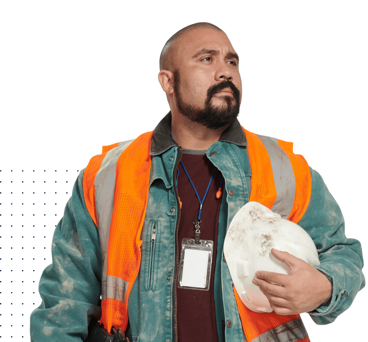 Man in construction PPE holding helmet