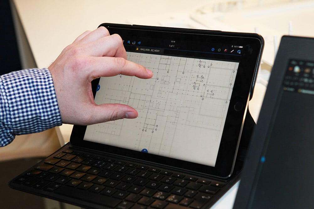 person viewing blueprint on tablet with Revu software