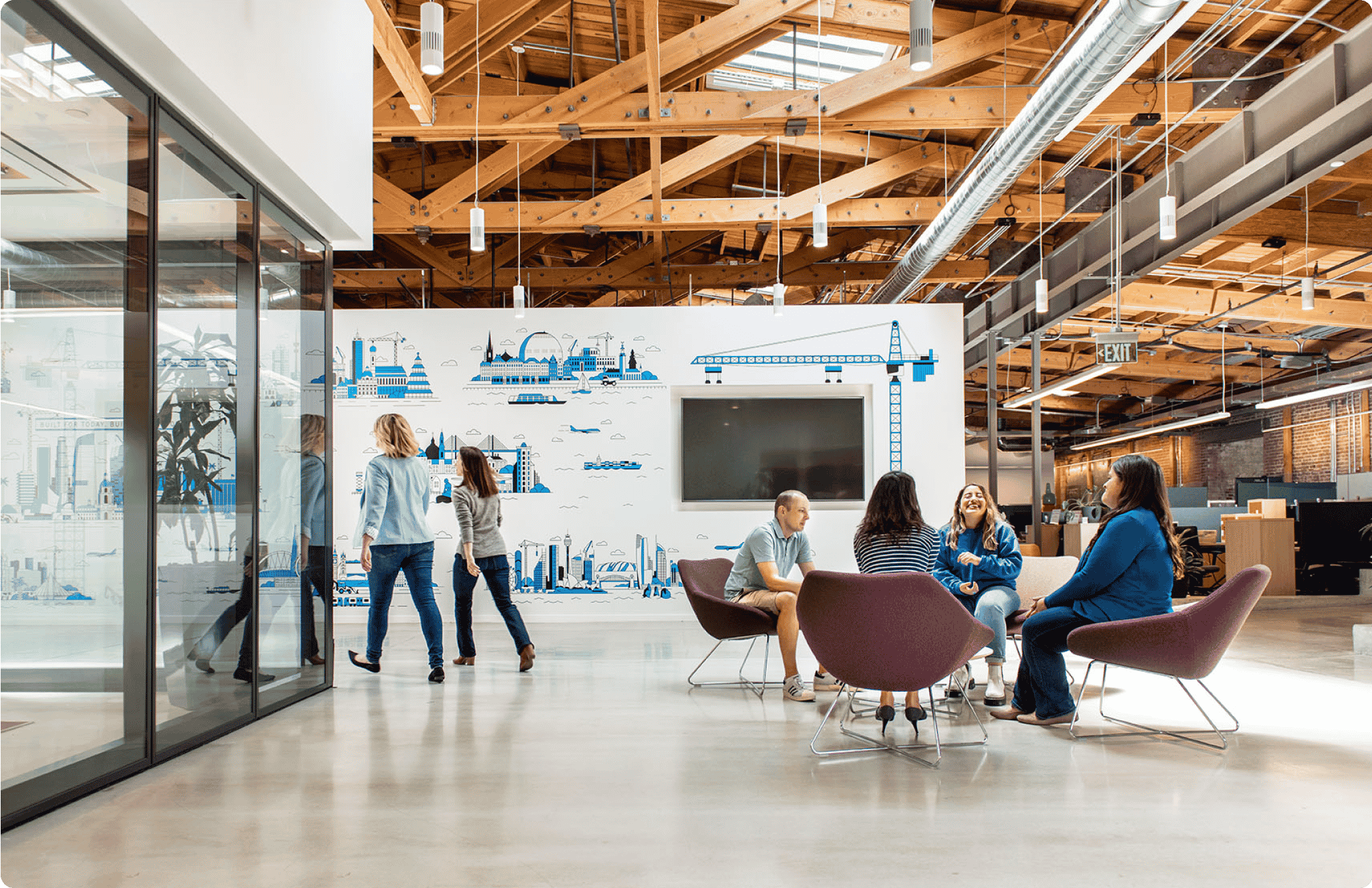 People sitting and walking in nice airy Bluebeam office