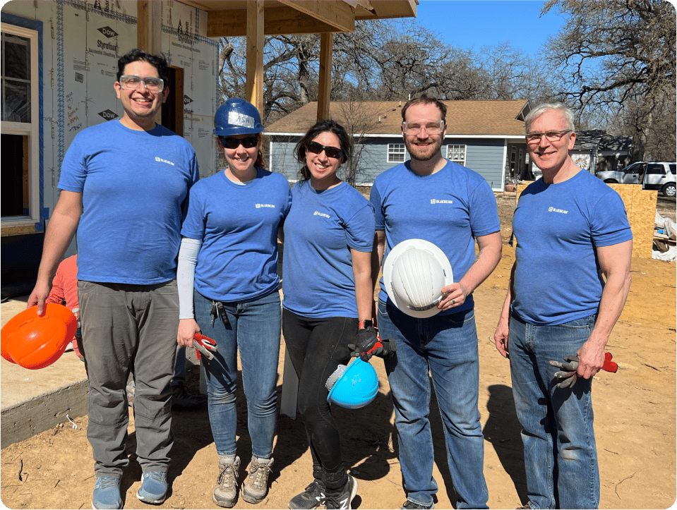 Bluebeam employees Standing Outside Smiling wearing construction gear