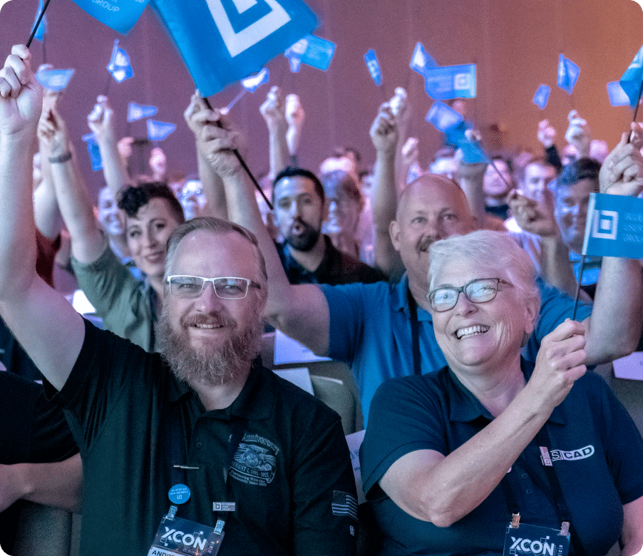 Crowd of people wave Bluebeam flags