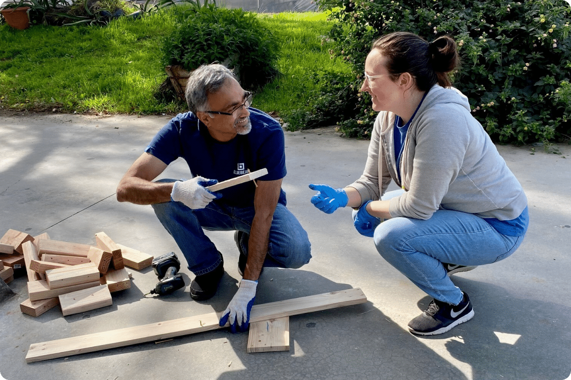 Two Bluebeamers volunteering for Habitat for Humanity