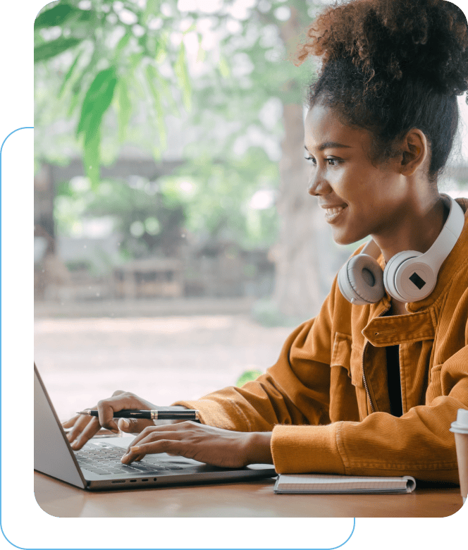 Woman smiling working on a laptop