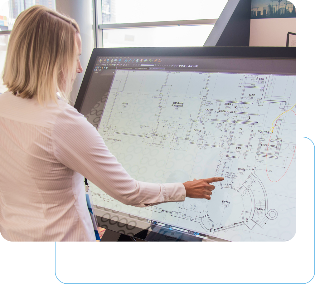 Office professional using Revu on a large touch screen