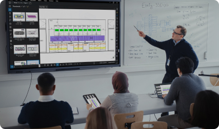 Teacher in classroom points to Revu on TV