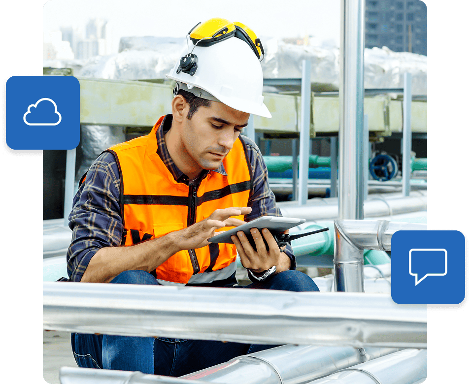 A construction worker in a safety vest and helmet uses a tablet at an industrial site, surrounded by pipes. Overlay icons of a cloud and chat bubble hint at contractor software or construction collaboration software in action.