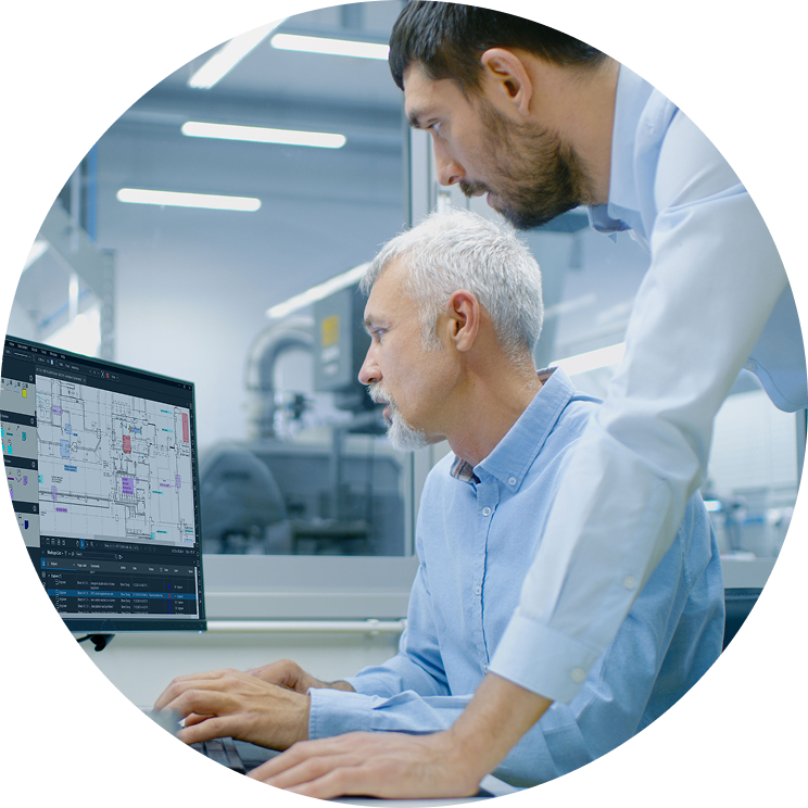 Two office workers looking Bluebeam Revu