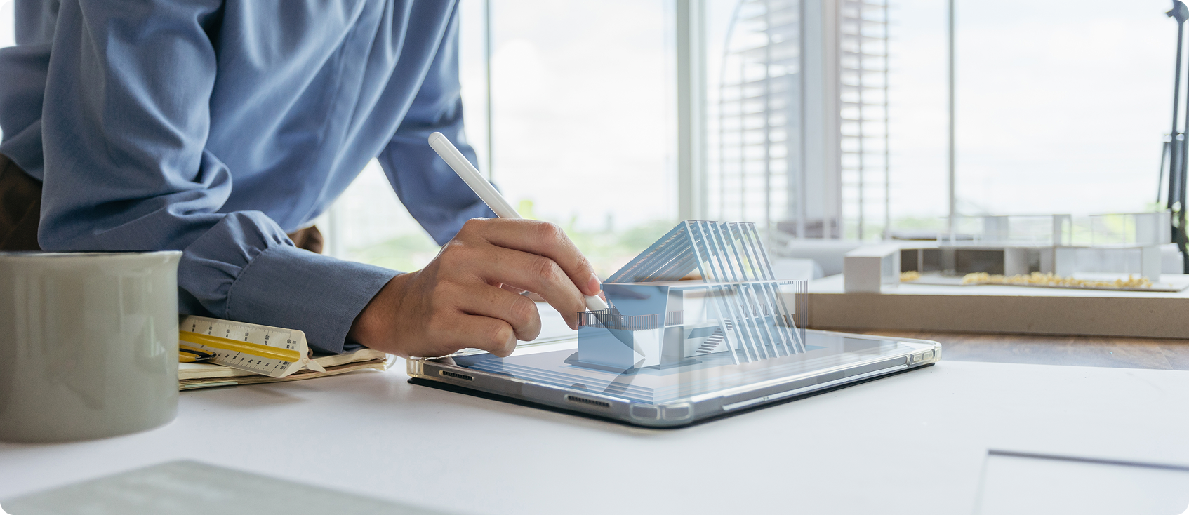  Office worker uses stylus on tablet at desk 