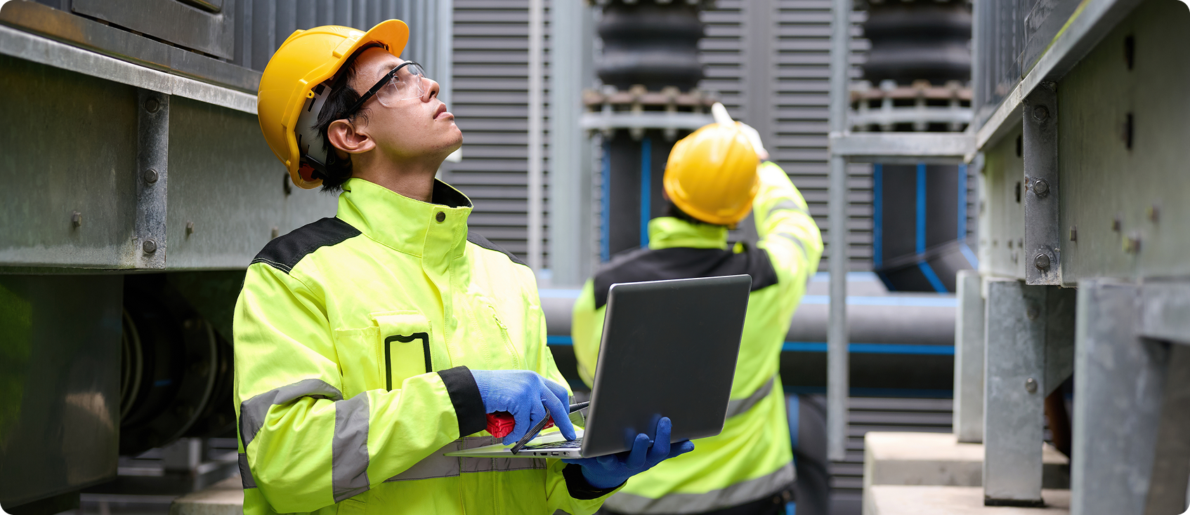  Construction workers examine jobsite 