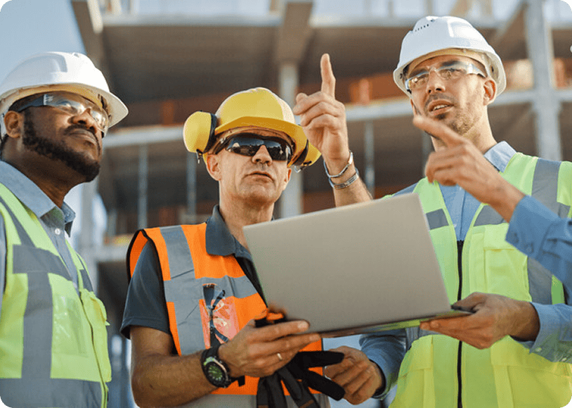 Construction workers holding a tablet