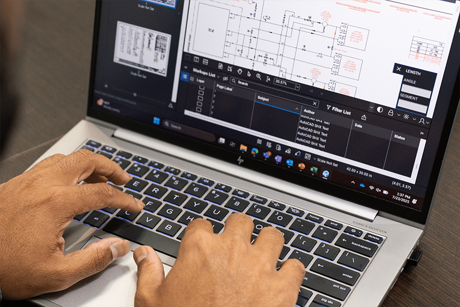 Hands on laptop keyboard with Bluebeam open