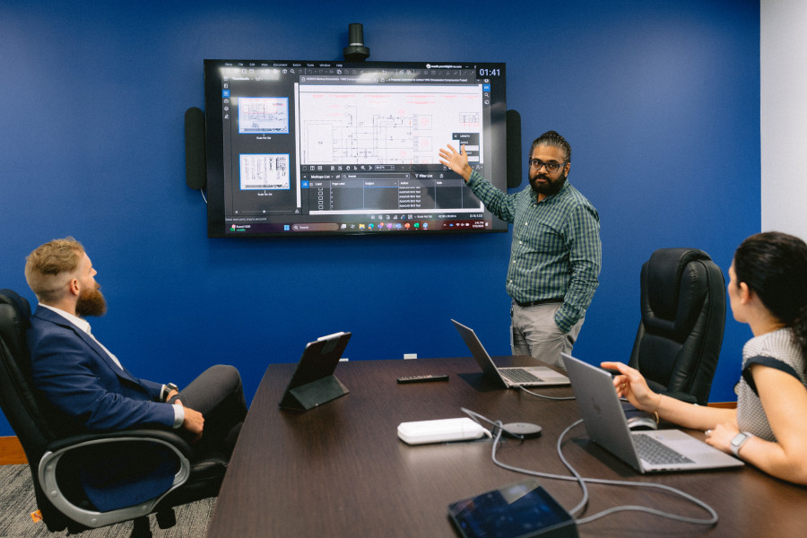 Conference room meeting with Bluebeam Studio on large screen