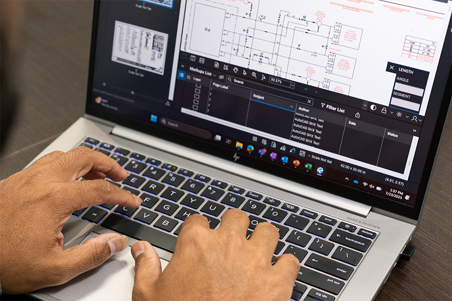 Hands on laptop keyboard with Bluebeam open