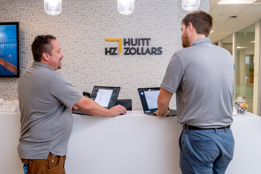 Colleagues review project documentation in Bluebeam at Huitt-Zollarsâ office.